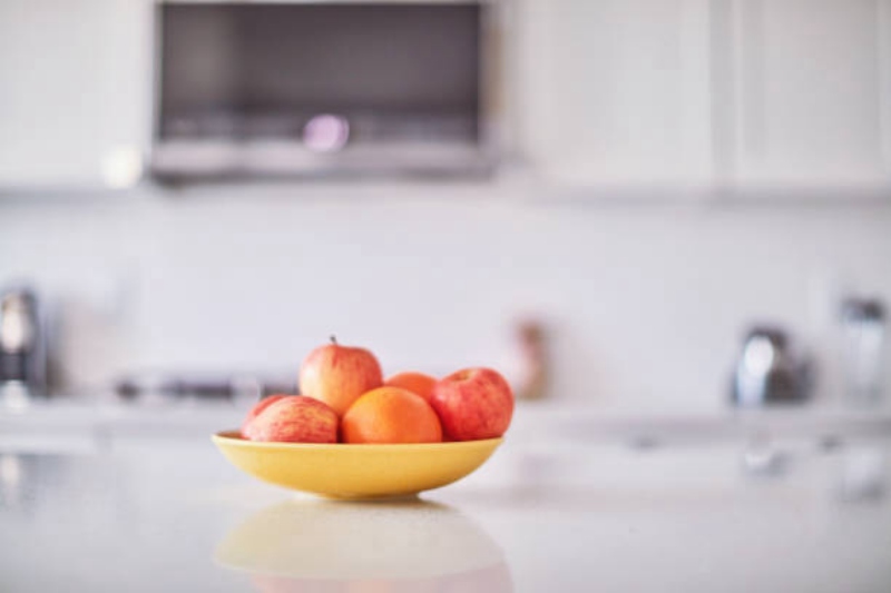 Bright kitchen counter with a bowl of fresh produce